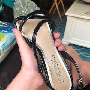 Patent leather worn strappy heels